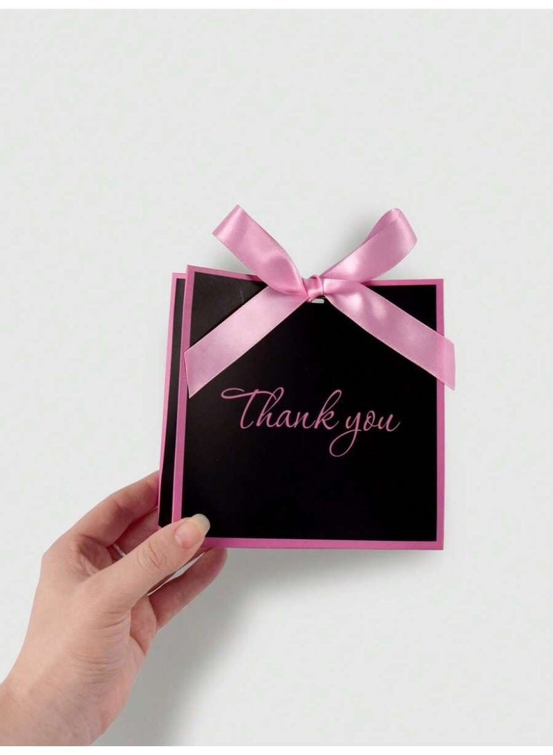 توزيعات العيد علب هدايا كرتونية سوداء أنيقة بحدود وردية وفيونكة ناعمة لتقديم الحلوى والهدايا 10 قطع - Image 4